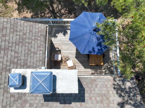 an overhead view of a blue umbrella on a roof at Short walk to Bayside Beach in Eastham
