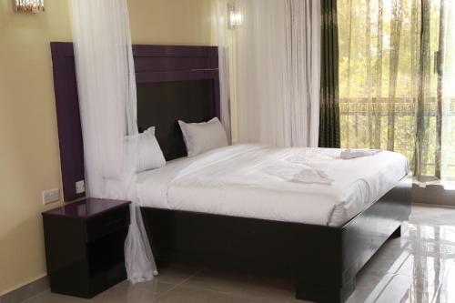 Postel nebo postele na pokoji v ubytování Sunstar Resort Thika