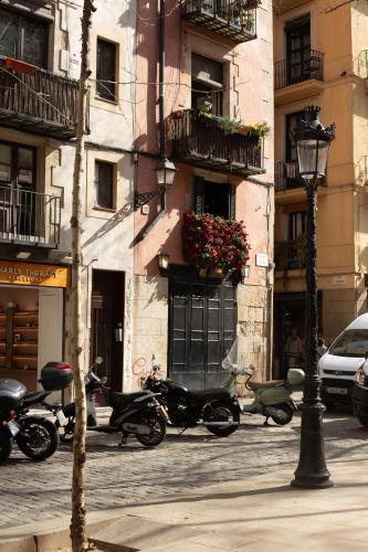 a group of motorcycles parked in front of a building at Miiro Borneta in Barcelona