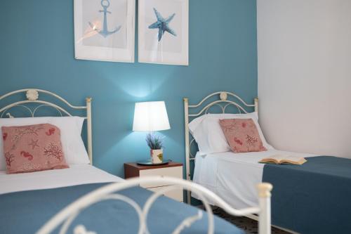 Katil atau katil-katil dalam bilik di Mare Villas Pescoluse
