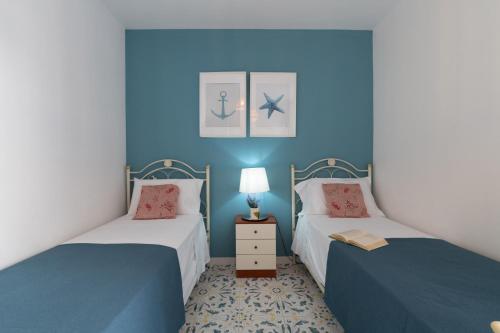 Katil atau katil-katil dalam bilik di Mare Villas Pescoluse