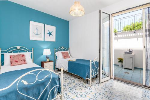 Katil atau katil-katil dalam bilik di Mare Villas Pescoluse