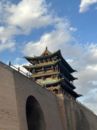 a building on the top of a bridge at Elsewhere Hotel Inn North Street Branch in Pingyao