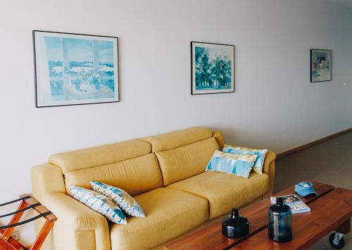 a living room with a couch and a coffee table at Alivi in Bastia