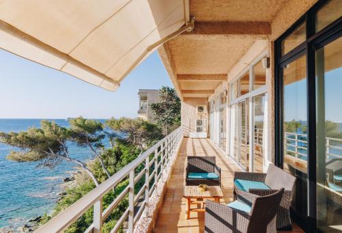 a balcony of a house with a view of the ocean at Alivi in Bastia