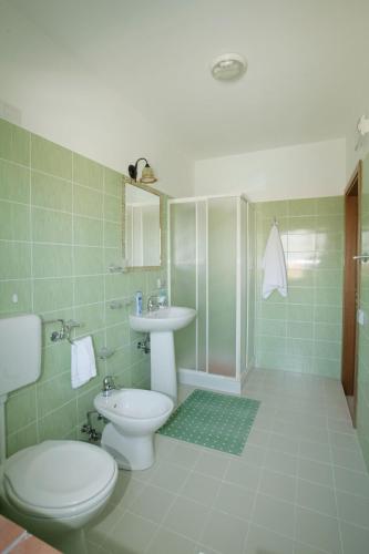 a bathroom with a toilet and a sink at B&B La Ganzaria in San Michele di Ganzaria