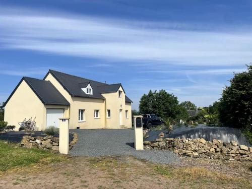 a large white house with a black roof at Spacious Luxury countryside retreat in Estry