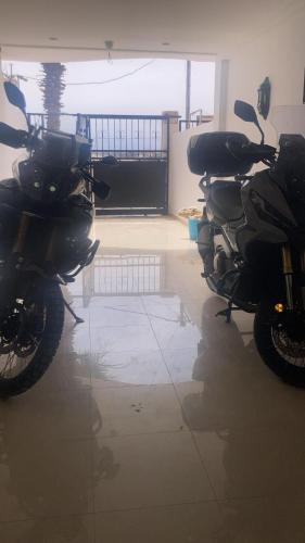 a couple of motorcycles parked in a garage at Dar Hachemia in Ras El Ma