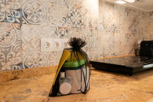 a room with a bed and a bag on the floor at Casa Esmeralda - Luxury Boutique Apartments Old Town in Estepona