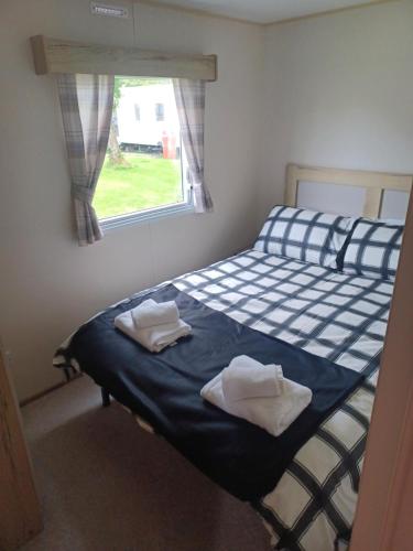 Ein Bett oder Betten in einem Zimmer der Unterkunft Ye Old'e Man Lake district Grange-over-Sands