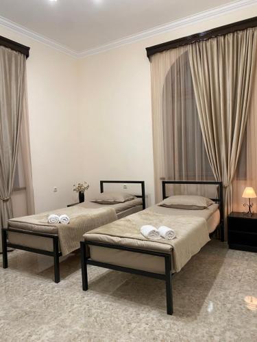 Postel nebo postele na pokoji v ubytování Yan Guest House