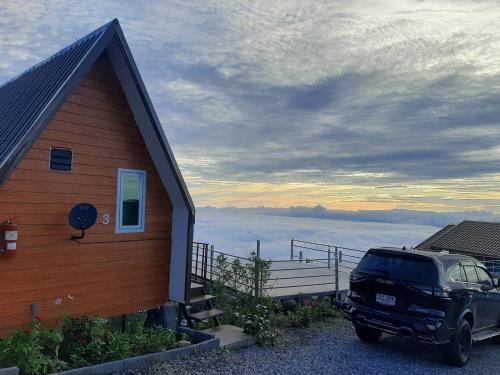 a car parked in front of a house with a view at Ing Ai Mhok Phu Thap Buek in Ban Tha Kok Hai