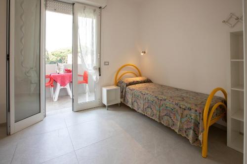 Postel nebo postele na pokoji v ubytování Residence La Pigna
