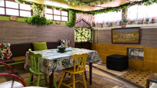 a dining room with a table and chairs at Casa Rodrigues in Santiago do Cacém