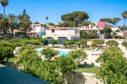 an aerial view of the villa and the swimming pool at Villa Venera Fontane Bianche Charme Apartments in Fontane Bianche