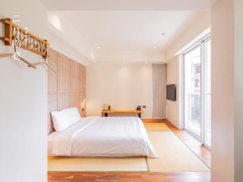 Postel nebo postele na pokoji v ubytování 28 Shu Xiang Hotel
