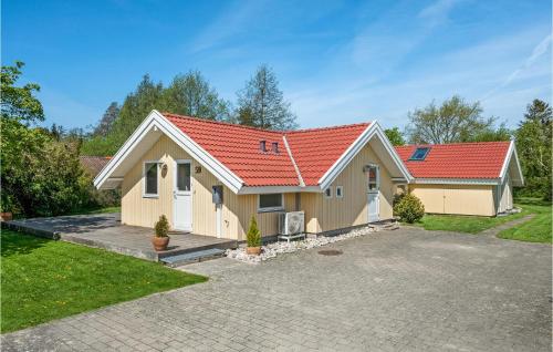 a house with a red roof at Holiday Home Gøgevej Dronningmølle Xi in Dronningmølle
