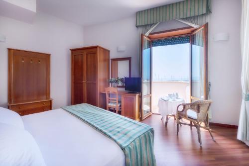Posteľ alebo postele v izbe v ubytovaní Astura Palace Hotel