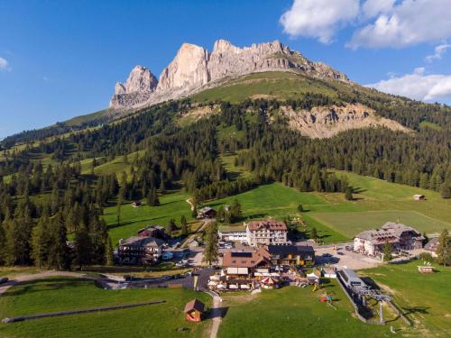 an aerial view of a resort on a mountain at Bar-Restaurant-Pizzeria Antermont B&B in Carezza al Lago