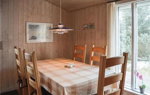 a dining room with a table and chairs at 4 Bedroom Stunning Home In Thisted in Thisted