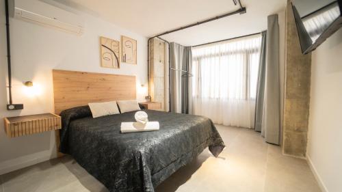 Katil atau katil-katil dalam bilik di H&H Suite Oasis Granada
