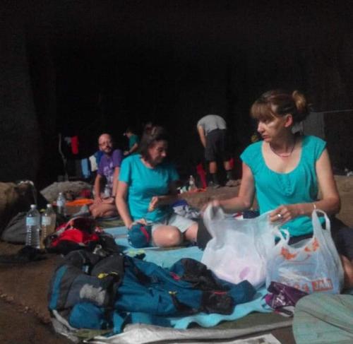 a group of people sitting on a blanket at Tahan Guest House in Kuala Tahan