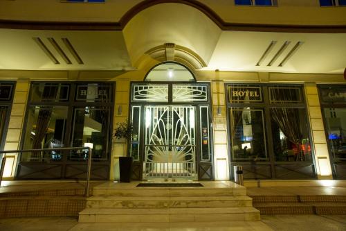 an entrance to a building with a revolving door at Davitel - Tobacco Hotel in Thessaloniki
