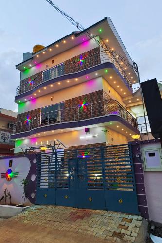 a building with lights on the side of it at JK Palace in Yelagiri