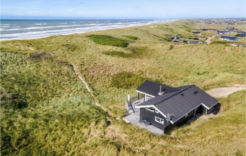 an aerial view of a house on a beach at Holiday Home Tingodden Denm I in Hvide Sande