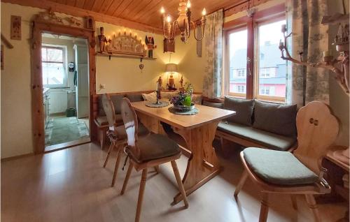 a living room with a table and a couch at Nice Apartment In Bad Schlema Ot Wildb in Schneeberg