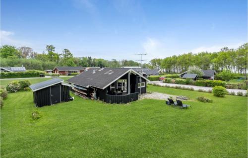 an overhead view of a black house in a yard at Holiday Home Pøt Strandby Juelsminde Ii Dnkm in Sønderby