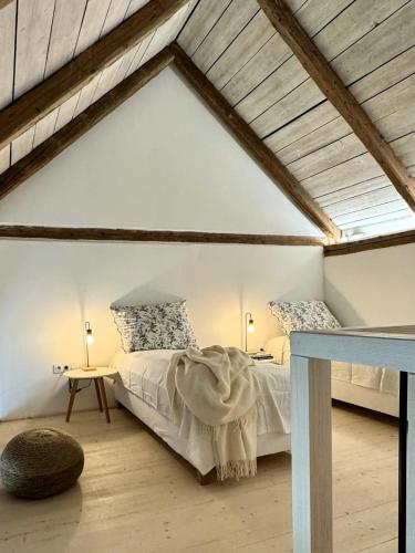 a bedroom with a bed in a attic at Semtěš 5 in Pšov