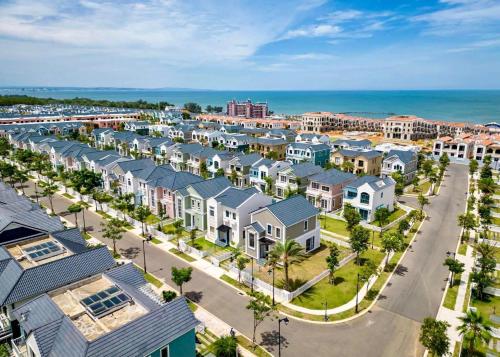 an aerial view of a city with houses and the ocean at Novaworld Beach villa in Phan Thiet