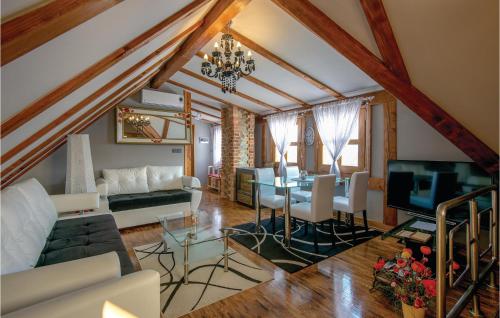 a living room with a couch and a table at Nice Home In Klanjec With Sauna in Klanjec