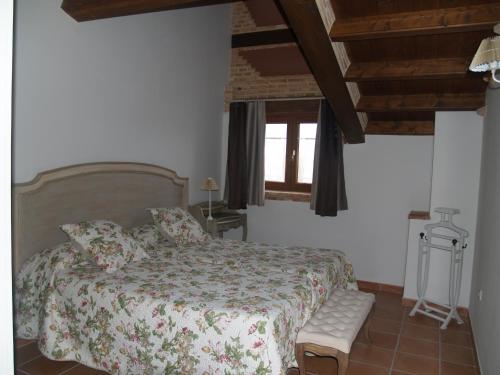 Ένα ή περισσότερα κρεβάτια σε δωμάτιο στο Casa Rural El Cuartel