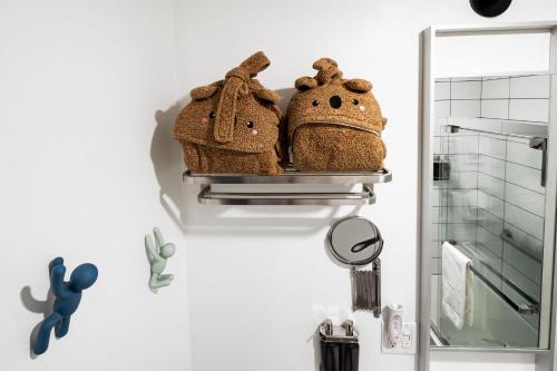 two baskets on a rack in a bathroom at Silverbow Inn in Juneau