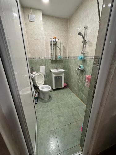 Koupelna v ubytování DINEVI APARTMENTS