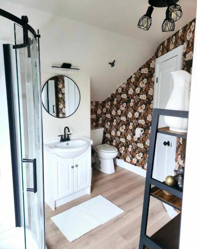 a bathroom with a sink and a toilet at Estrella Glamping in Caraquet