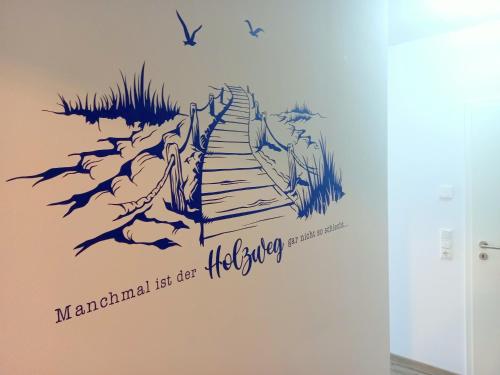 a wall mural of a staircase with the words mandril let the gate get higher at Boddenblick 9 a in Fuhlendorf