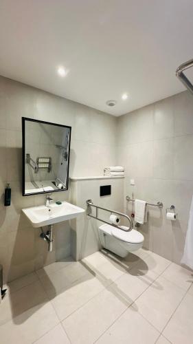 a bathroom with a sink and a toilet at Hilton Garden Inn Casablanca Sud in Casablanca