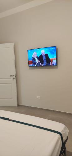 TV a/nebo společenská místnost v ubytování Il Cortile di Mabe