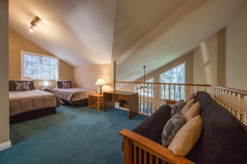 a room with two beds and a balcony at Marble Canyon in Fairmont Hot Springs