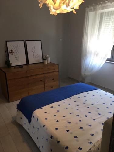 Una cama o camas en una habitación de Per me si va