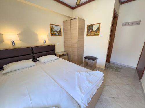 Katil atau katil-katil dalam bilik di Limanaki Rooms Thassos