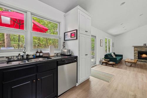 a kitchen with a sink and a stove at The High Life in New Buffalo