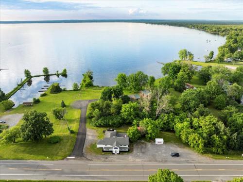 an aerial view of a house next to a lake at Whitewater The Genoa on Oneida Lake Sleeps 8 in Canastota