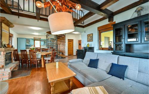a living room with a couch and a table at Nice Home In Zelezna Gora With Sauna in Grabrovnik
