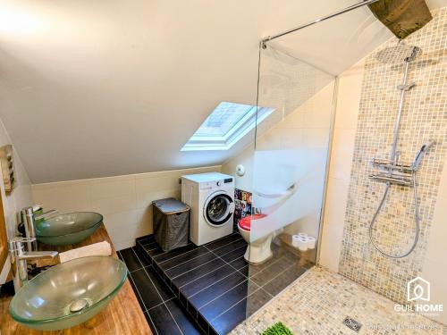 a bathroom with a shower and a washing machine at Le Spacieux - Vue Loire - Queen Size - Free Parking in Orléans