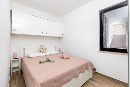Postel nebo postele na pokoji v ubytování Apartments Val