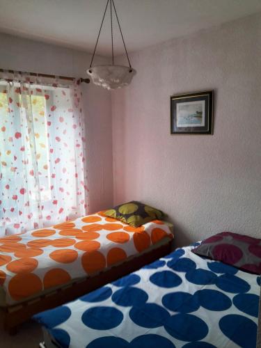 a bedroom with a bed and a window at Gîte "À Moussey vous" in Moussey